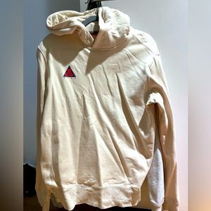 Nike ACG tan hoodie with speckled sleeve details, good as new condition